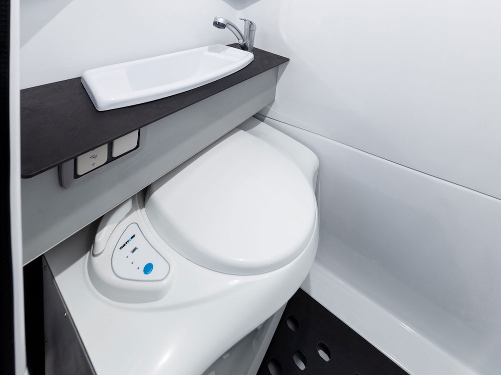 Slide away toilet fits under the basin in the Trakka campervan