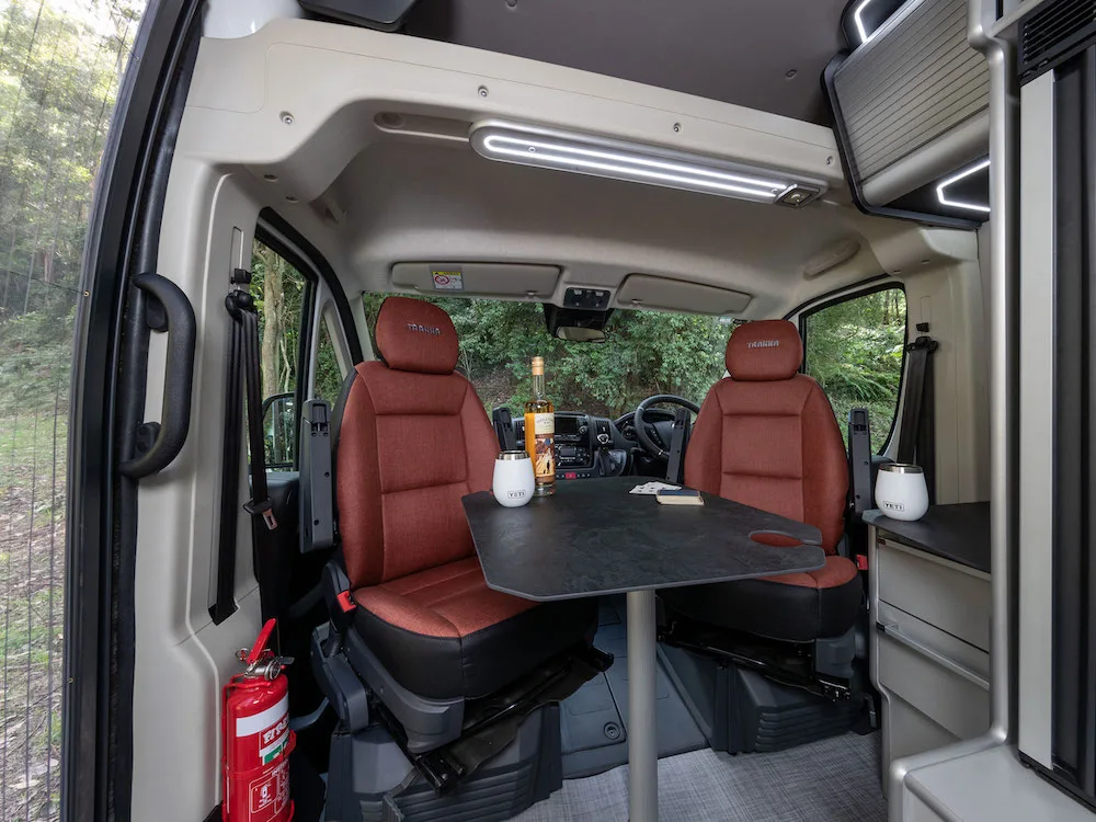 Inside view of Trakka campervan showing seats turned around