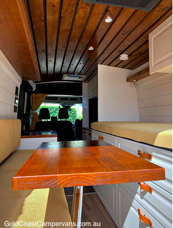 Dining area of a van that has been converted to a camper.