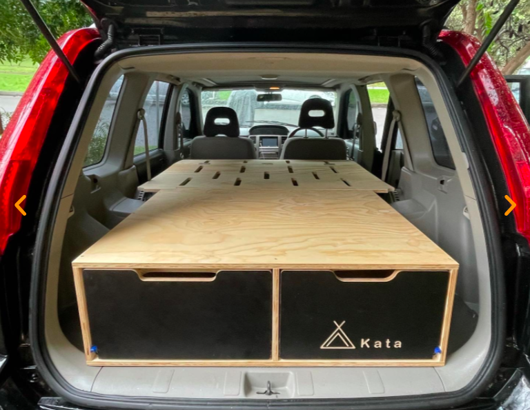 Removable campervan unit in the back of an SUV.