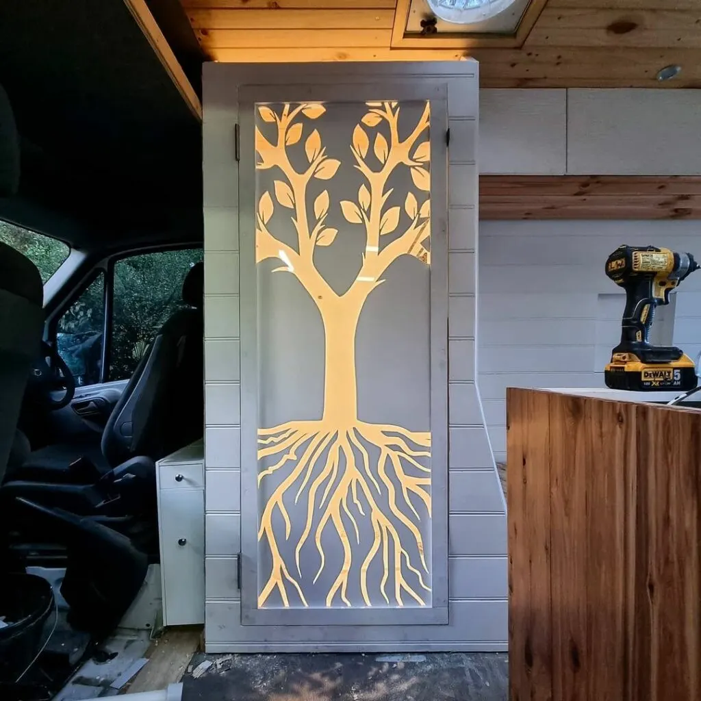 Unique shower door inside a Class B camper van.