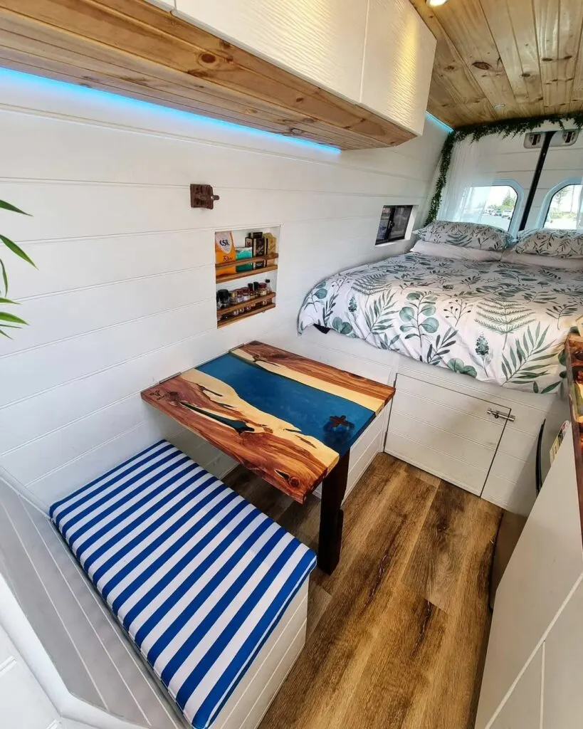 Vibrant blue resin table inside a campervan.