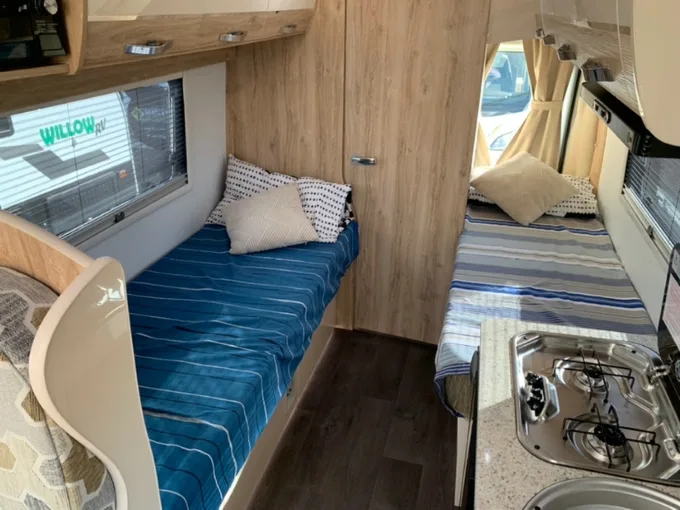 Twin beds inside the Avan Applause 600 camper van.