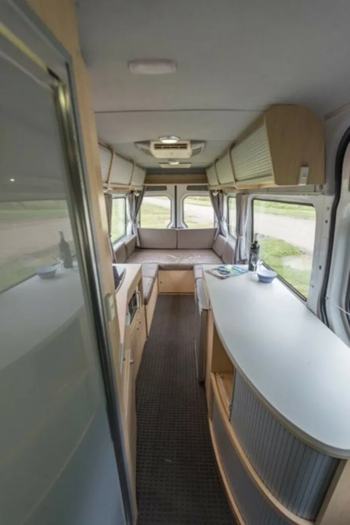 Inside view of a white Kea Ultima camper van.