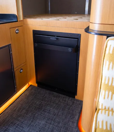 Tetravan folding shower shown in the stored/folded up position in a campervan.