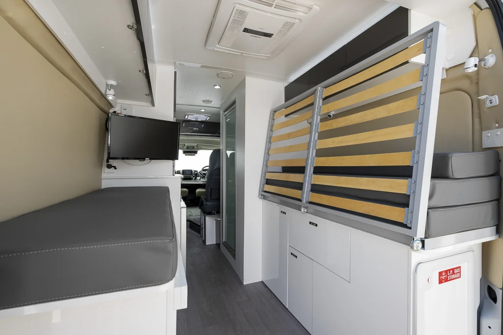 Interior view of a Windsor Otway campervan showing the garage/bed area in the back.
