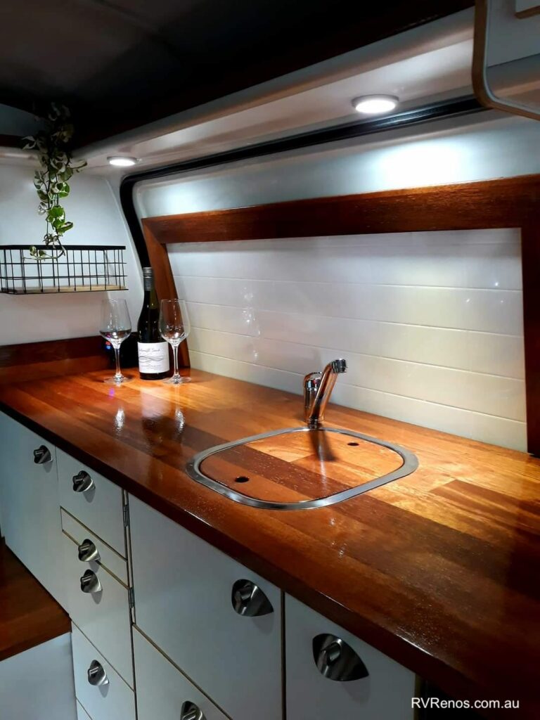 Beautiful wooden kitchen benchtop in a converted Toyota Hiace van.